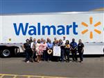 People in front of a truck